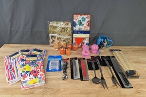 lot 164 image: Assortment of NEW Kitchen Items Knives, Dish Towels, Cooking Utensils, Salt & Pepper Shakers, Wonder Woman Mug, Egg Slicer, Dish Drying Mat and More K