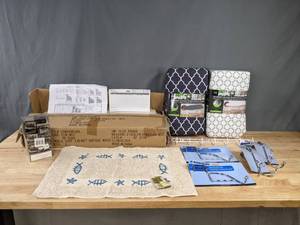 lot 140 image: NEW Assorted Home Goods Triple Step Cabinet, Bath Mat, Over the Door Hooks, Shower Hooks, Ironing Board PadsCovers K