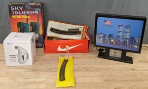 lot 249 image: United we Stand Clock, New Portable Garmet Steamer, Vintage Fisher Prive Sky Talkers and Various Pieces of Railroad Tracks   M