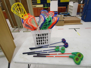 lot 181 image: Small LaCrosse Sticks & Golf Clubs