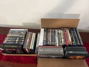 lot 93 image: 2 Boxes of DVDs - Many Sealed