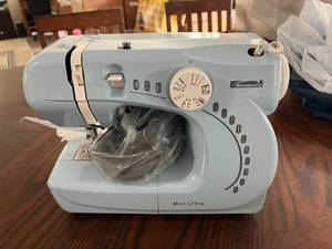 lot 215 image: Kenmore Mini Ultra Sewing Machine