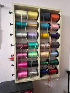 lot 284 image: Wall Mounted Ribbon Organizer & Contents