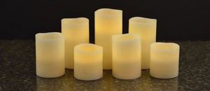 lot 38 image: Members Mark 7-Piece Flameless Candle Pillar Set with Remote and Timer
