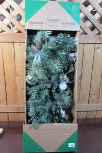 lot 44 image: 9 Foot Pre-Lit Decorated Garland 90 LED Lights Pine Cones Ornaments