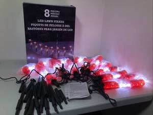 lot 49 image: 8 Piece Candycane LED Lawn Stakes