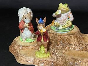 lot 85 image: Royal Doulton Beatrix Potter Set of 4 Characters and Base Stump
