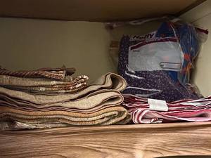 lot 104 image: Closet of Tablecloths, Napkins, Napkin Rings