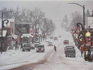 lot 62 image: Snowy Day on Main Street Framed Print - Signed