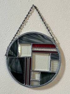 lot 31 image: BlackGrayRed Stained Glass piece