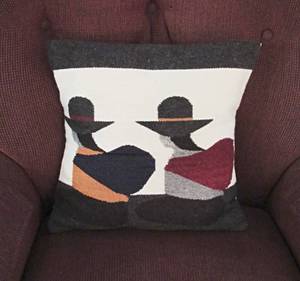lot 52 image: Burgundy swivel club style chair with pillow