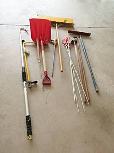 lot 79 image: Yard Bundle Three with trashcan and lid and stuff in trash can and lid