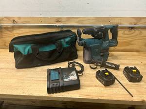 lot 20 image: MAKITA Hammer Drill with HEPA Filter, 2 Batteries, a Charger and Carrying Bag
