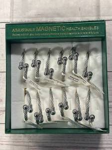 lot 25 image: Full Box of 12 Magnetic Health Bangles ($24 retail each)