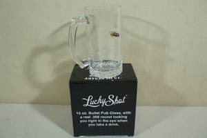 lot 52 image: Lucky Shot Pub Glass with Embedded Bullet