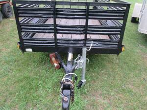 2006 Redi Haul utility single axle trailer permanent  registration MN ADCX-458 bed is 5 foot x 10 foot 40 inch hitch, rear ramp, 3 foot high stake sides 2 inch ball hitch, 2000 lb max load, ready to haul