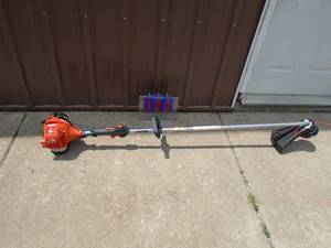 lot 103 image: Echo straight shaft line trimmer. Like new. Tested & works. As shown.