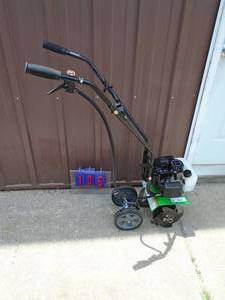 lot 106 image: Tozz mini tiller. Lightly used. Tested & works. As shown.