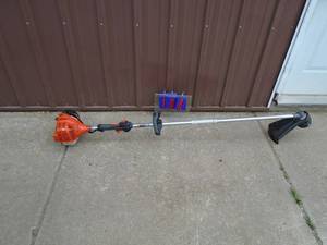 lot 108 image: Echo straight shaft line trimmer. Lightly used. Tested & works. As shown.