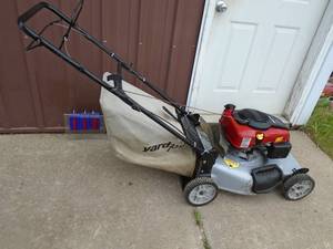 lot 110 image: Yard Machine self proppeled lawn mower with bag. Tested & works. As shown.