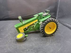 lot 811 image: John Deere 730 Diesel Plastic Tractor Model - Made by Yoders New Paris, IN - 116 Scale - Front Wheels Broken Off