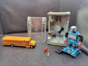 lot 858 image: 1960s Zeroids Zerak Robot Toy and International Scholl Bus