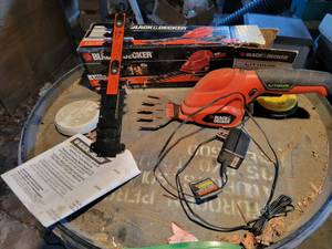 lot 212 image: Black & Decker 2n1 Cordless Garden Shear with Box, Book and Charger - Tested and Works