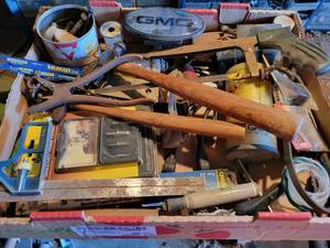 lot 215 image: Box of Assorted Hand Tools and Hardware - Screw Extractors, Hammers, Square, John Deere 2-Cycle Oil Measuring Cup, GMC Hitch Cover and More