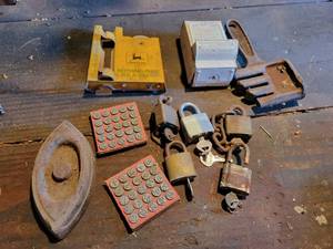 lot 220 image: Antique Waseca Processing Co. Match Holder, John Deere Rain Gauge (Missing Glass), Padlocks, Sad Iron, Belt Dresser and Number Markers