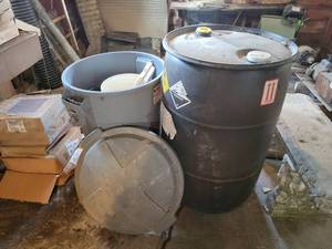 lot 257 image: 55-Gallon Poly Drum (Empty), Rubbermaid Trash Can with Lid and Assorted Buckets