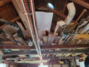 lot 258 image: Large Lot of Wood, Tin and More in Garage Rafters
