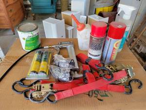 lot 285 image: Mini Grease Gun with (2) john Deere Cartridges, John Deere Sprayer Bottle, Straps, Paint and More