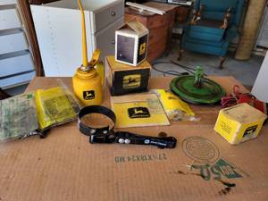 lot 292 image: John Deere Oiler Can, John Deere Filter Wrench and John Deere Parts