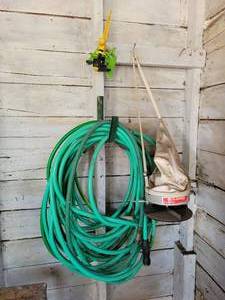 lot 298 image: EV-N-SPRED hand Seeder, Garden Hose and Sprinklers