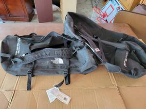 lot 328 image: (2) Chevy Avalanche North Face Duffle Bags - One has Original Tags on