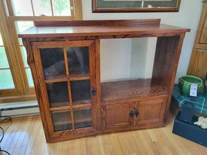 lot 48 image: Solid Wood Entertainment Stand with Glass Door and Adjustable Shelves