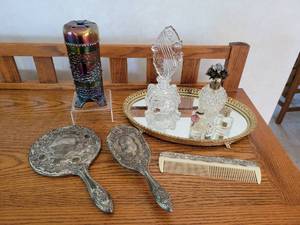 lot 91 image: Silver-Toned Vanity Set, Perfume Bottles, Mirrored Tray, and Vintage Fenton Blue Orange Tree Three Footed Hatpin Holder