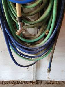 lot 424 image: Large Lot of Garden Hoses - Around 4 Hoses