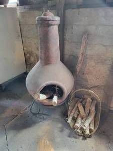 lot 433 image: Terra Cotta Chiminea with Wood