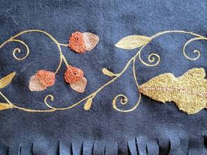 lot 49 image: Black Wool Crewelwork Embellished Lap Blanket