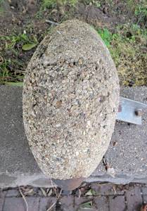 lot 21 image: River Rock Embedded Windmill Weight