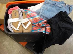 lot 51 image: Tote with Cover Filled with Clothes...