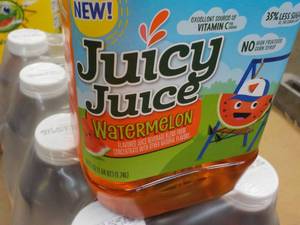 lot 381 image: 8 Pack 59 oz Bottles Juicy Juice Wa...