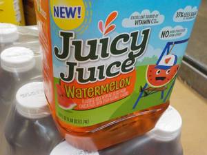 lot 382 image: 8 Pack 59 oz Bottles Juicy Juice Wa...