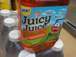 lot 384 image: 8 Pack 59 oz Bottles Juicy Juice Wa...