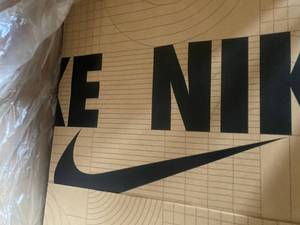 lot 128 image: Nike Shopping Bags