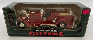 lot 22 image: Vintage  Ertl Collectibles 1937 Aherns-Fox Fire Truck  Die-Cast Bank Red