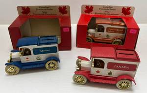 lot 30 image: Three Vintage Canadian Provincial Series Ertl Die-Cast Collectible Banks 1913 Model T Ford  1 ( Quebec ) ( Open In Original Box ) 1 ( Prince Edward Island ) 1 ( Canada ) ( No Box )
