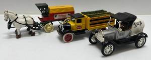 lot 37 image: Three Ertl Collectibles Die- Cast Misc. Soda Beverage Banks 1 ( Dr. Pepper ) Delivery Buggy , 1 ( Barqs ) 1918 Ford Model T Runabout 1 ( Coca Cola ) 1931 Hawkeye (No Boxes)