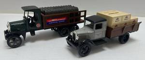 lot 59 image: Two  Ertl Collectibles Die- Cast Metal Banks (No Boxes)  With Gasoline &amp Oil Advertisement 1 ( AMOCO ) Truck 1 ( Mobiloil )  Truck
